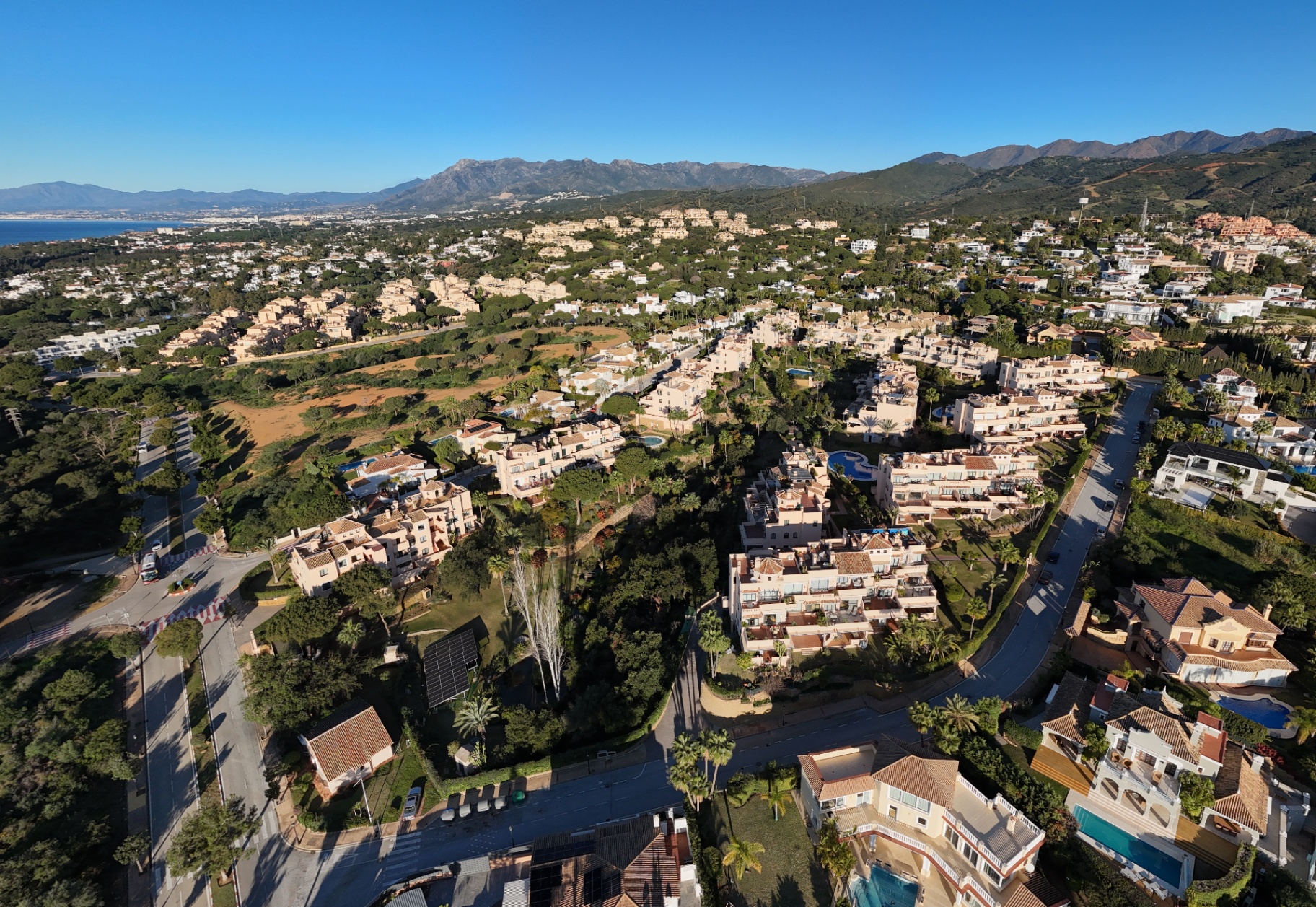 Aerial view of Elviria with Santa María Golf and the Mediterranean